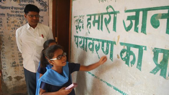A child with a visual impairment learns in a school in India.