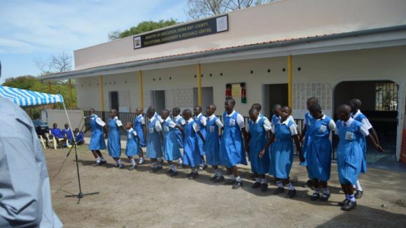 Children line up at an educational assessment centre in Kenya.