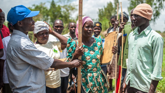 Students practice using measuring sticks to calculate drug dosages in Masindi, Uganda.