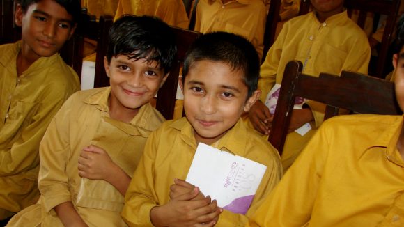 Children attend a seminar for World Sight Day in Pakistan.