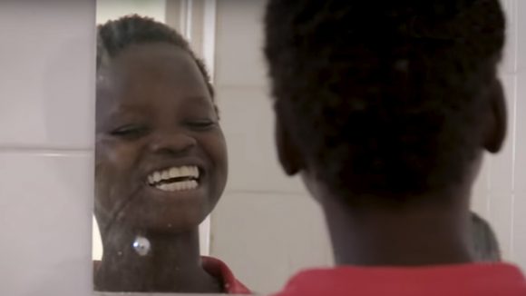 Rose looking at herself for the first time after cataract surgery.