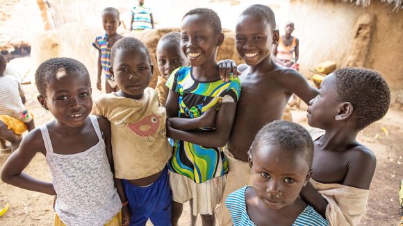 Children smile at the camera after the final trachoma treatment campaign in Yendi, northern Ghana.