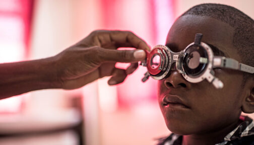 A boy in Zanzibar wears special specs to have his eyes tested.