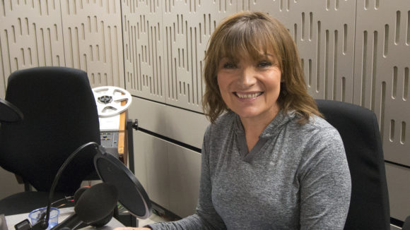 Lorraine Kelly smiles in the radio studio during the Sightsavers Radio 4 campaign.