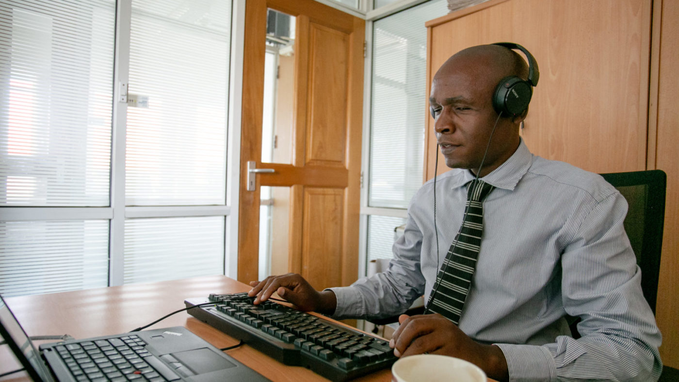 Deus working at his desk.