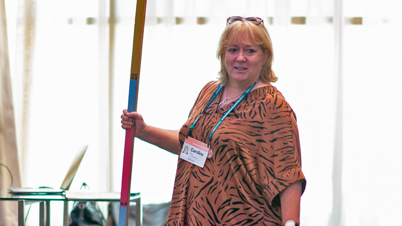 Caroline Harper speaks at the TED summit in July 2019.