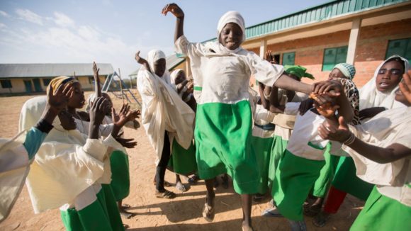 Children celebrate at school leading up to the one billionth NTD treatment.