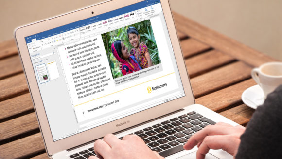 A close-up of a laptop screen showing a Sightsavers Word document.