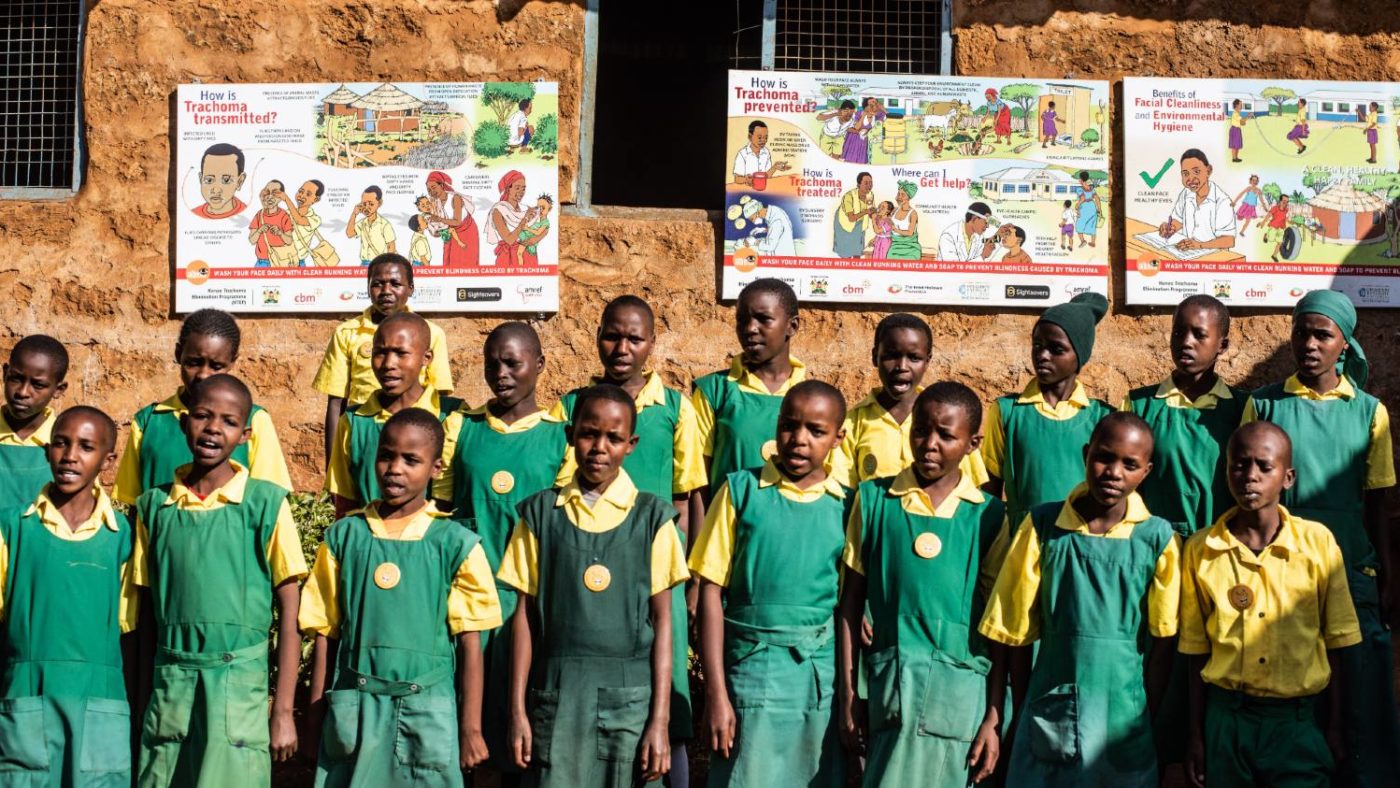 School kids stand together for a group photo.