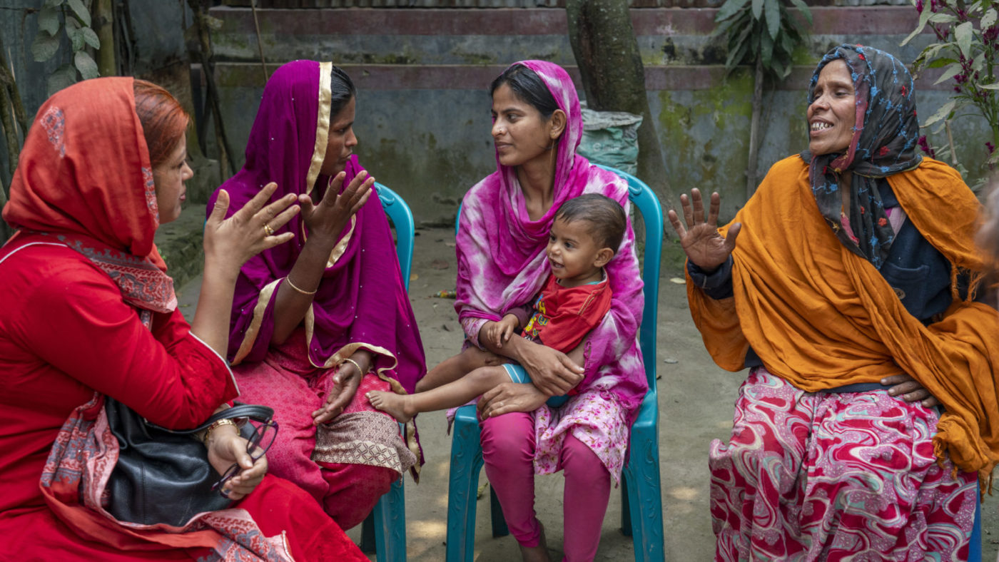 Asma talking to the family of Shamima, a patient with disabilties.