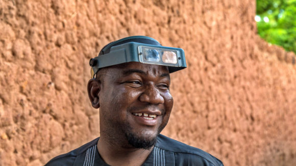 A male nurse smiling.