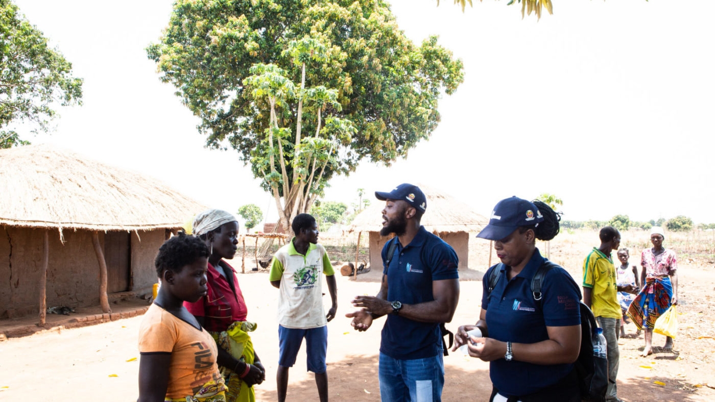 The survey team for the Onchocerciasis Elimination Mapping project explain to community members what is involved in the survey.