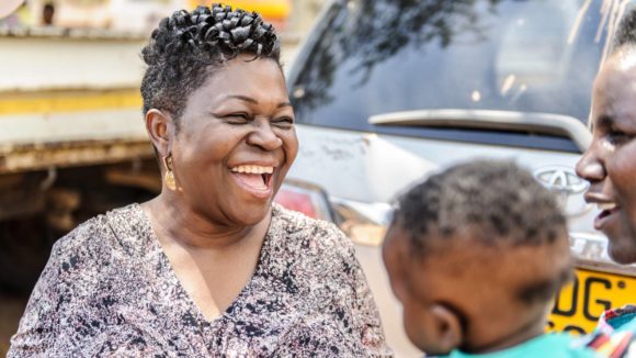 A woman laughing.