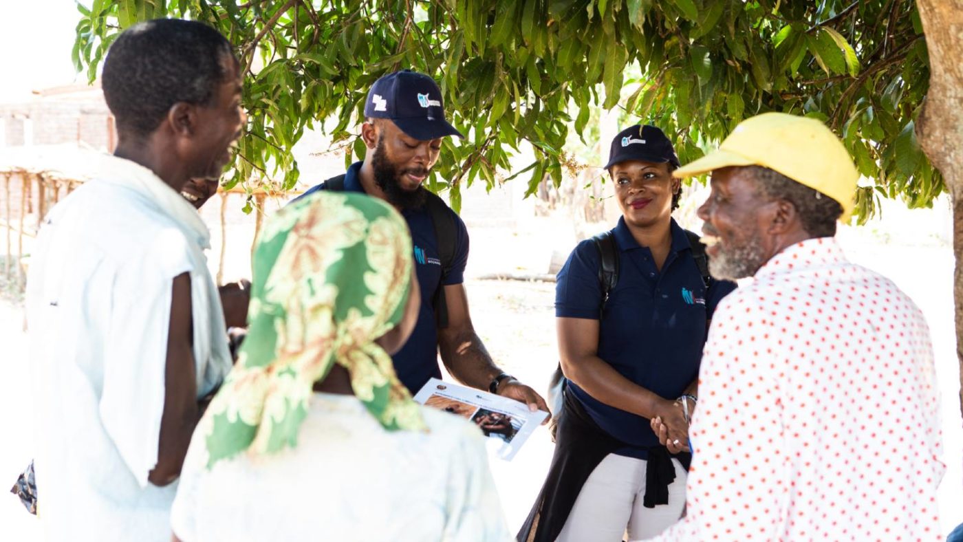 The survey team for Onchocerciasis Elimination Mapping project explain the survey activity to community members.