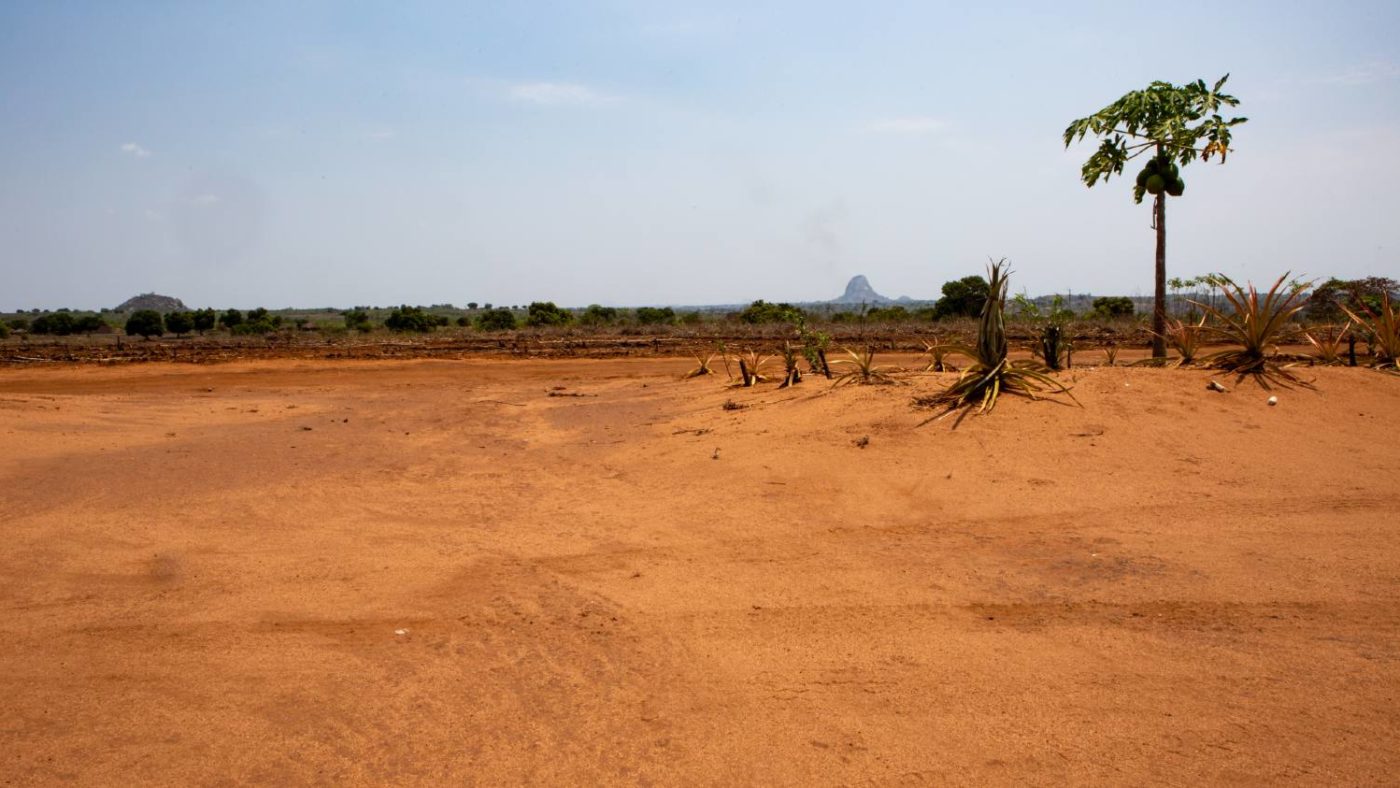 Landscape photo with mountain in the background of community in Zambezia, Mozambique.