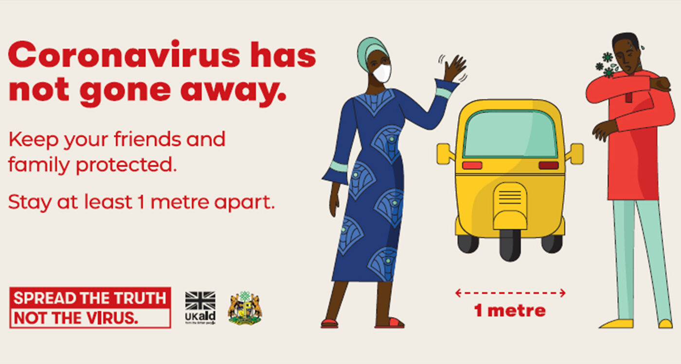 A poster that says 'COVID has not gone away' and showcasing one-meter social distancing.