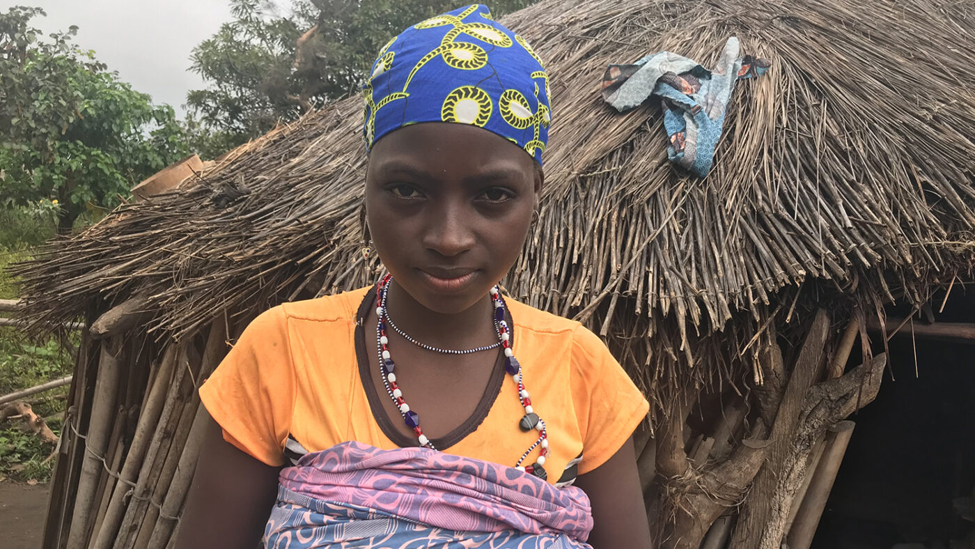 A woman stands for a portrait.