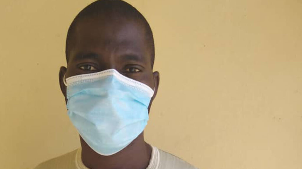 A portrait of a man wearing a face mask.