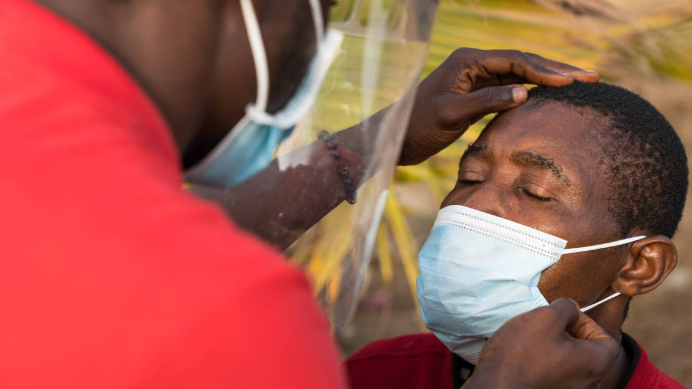 A man has his eyes checked for signs of trachoma.