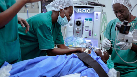 Two surgeons operate on Souleymane's cataract