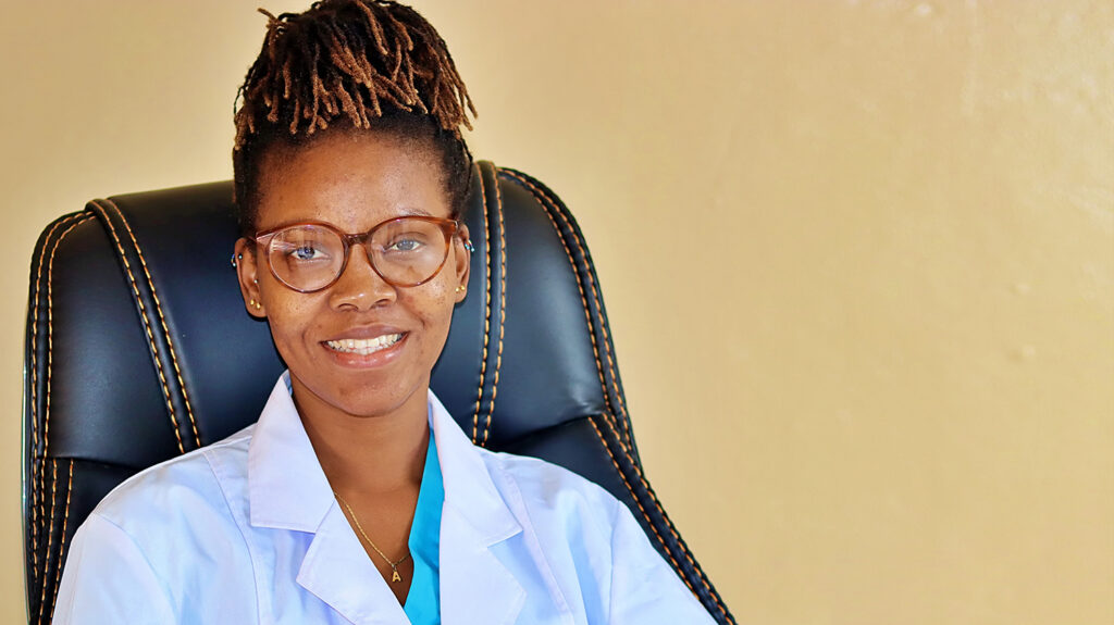 Dr Jalikatu smiles while wearing her surgical coat.