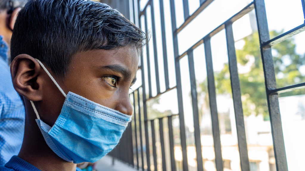 Shahadeb post surgery, can see clearly and looks out of the window.
