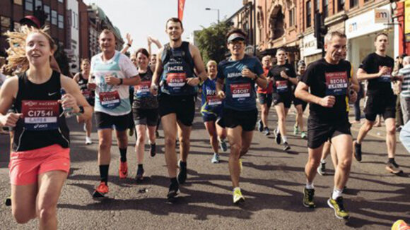 Smiling runners on the streets of Hackney.