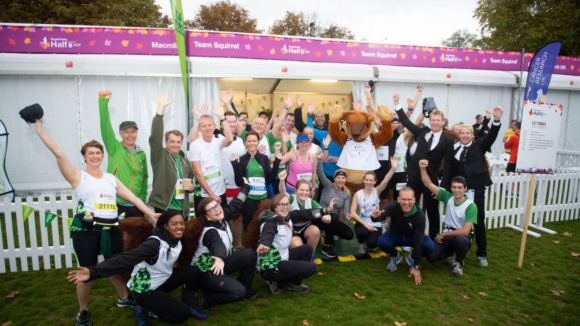 Runners and event staff pose for a photo.