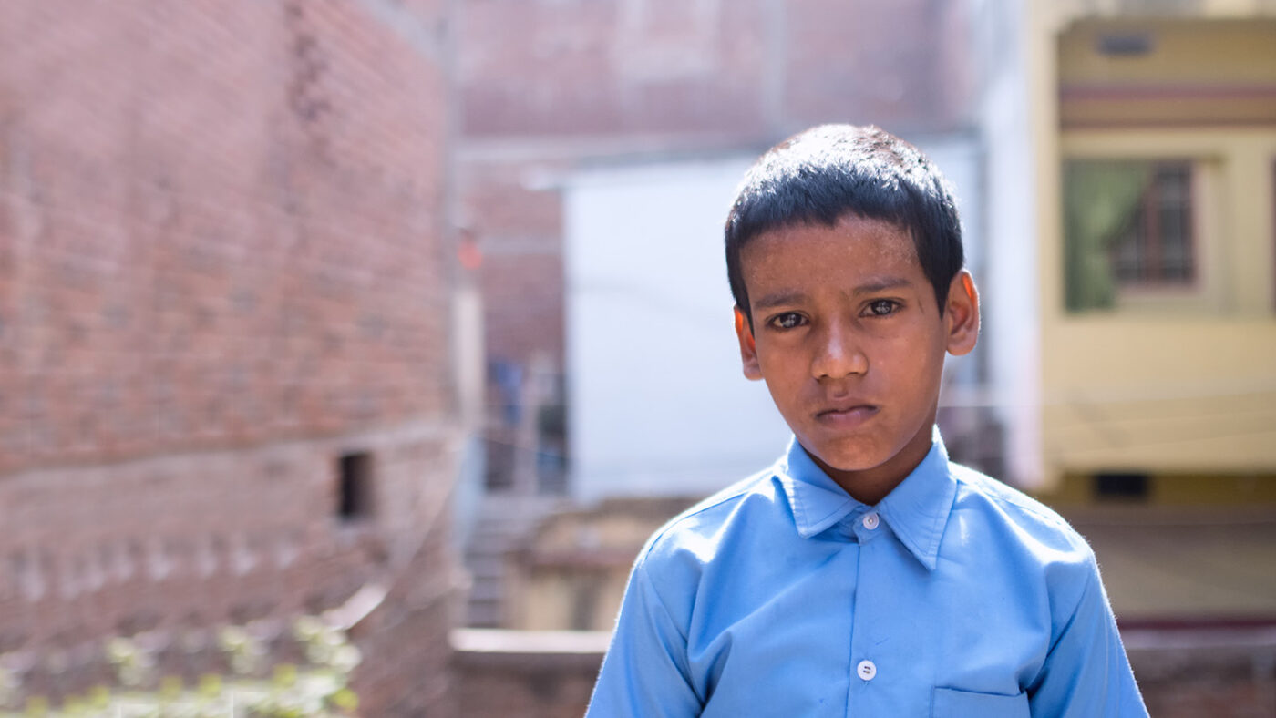 Shahid standing outside his home in Patna India
