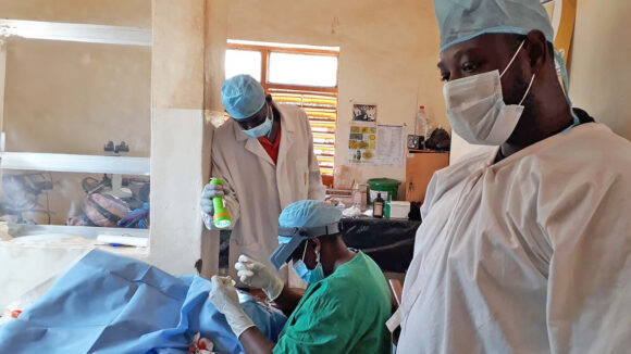 Eye health workers in Guinea perform surgery to treat advanced trachoma.