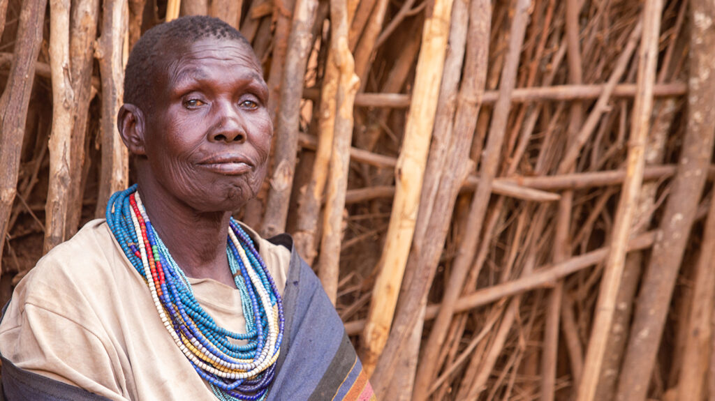 Maria sits outside her home after her cataract operation.