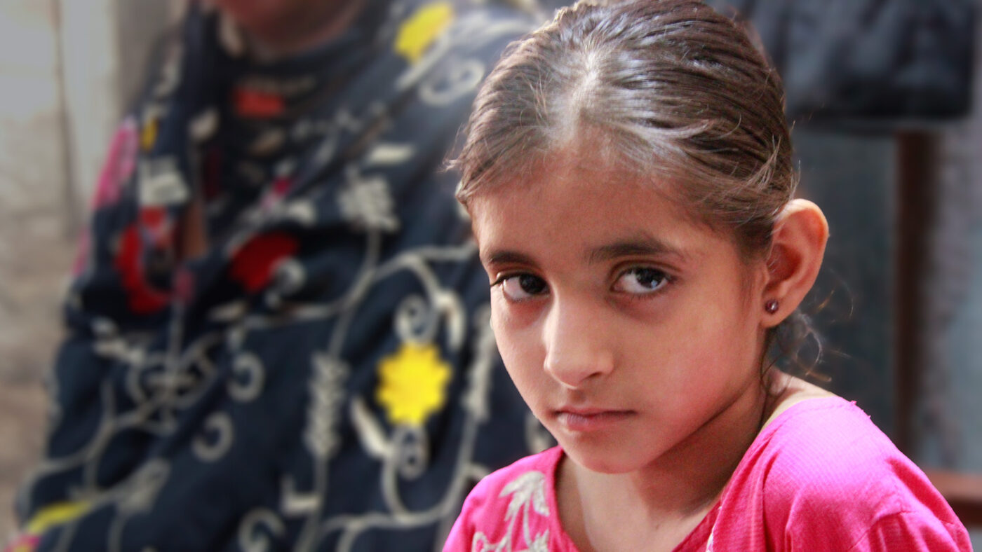 Nayab looks at the camera.