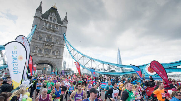 Hundreds of runners race across Tower Bridge.