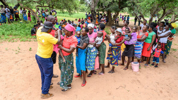 Ndumiso Ndlovu, an ophthalmic nurse checking the eyes of people from a local community in Zimbabwe