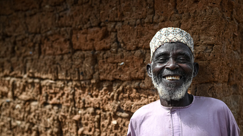 Ado smiles after receiving medication to protect him from river blindness.