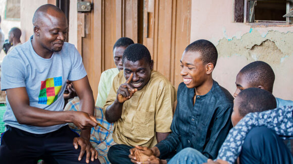 A group of men laughing together.
