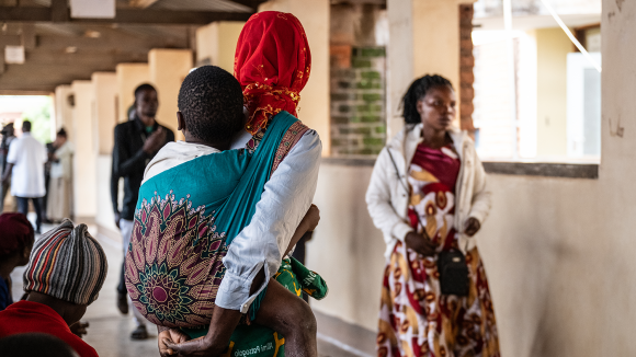 A woman carrying her baby on her back at the surgical camp at Zomba Central Hospital.