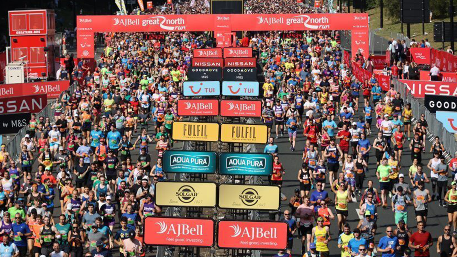 A large crowd of people running at the Great North Run.